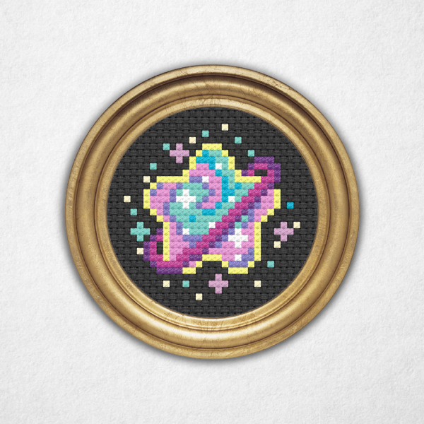 Digital rendering of a cross stitch pattern on black Aida cloth in a round metal frame a star shaped purple ringed planet with pink and sea green swirls! This compact design is a great choice for a framed piece, jewelry, ornaments, and so much more – for beginners and experts alike!