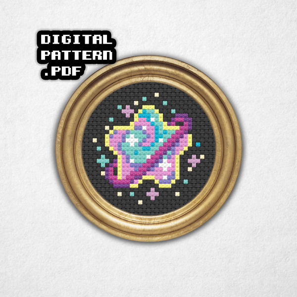 Digital rendering of a cross stitch pattern on black Aida cloth in a round metal frame a star shaped purple ringed planet with pink and sea green swirls! This compact design is a great choice for a framed piece, jewelry, ornaments, and so much more – for beginners and experts alike! Digital Pattern PDF is in bold text in the top left.