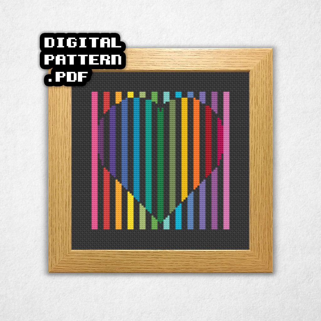 Digital rendering of a cross stitch pattern on black Aida cloth in a square wooden frame of columns of vertical stitches in colors of the rainbow with space in the aida between the columns. In the center is a heart in reverse colors of the background. Digital Pattern PDF is in bold text in the top left.