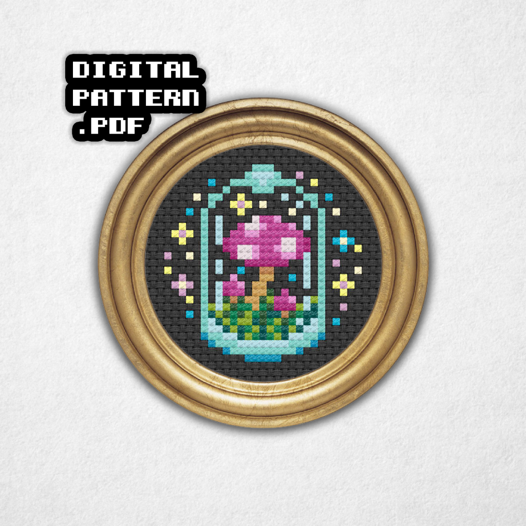 Digital rendering of a mini cross stitch pattern on black aida cloth in a round gold frame of a group of pink and purple mushrooms with white spots in a glass container surrounded by colorful sparkles and stars! Digital Pattern PDF is in bold text in the top left.